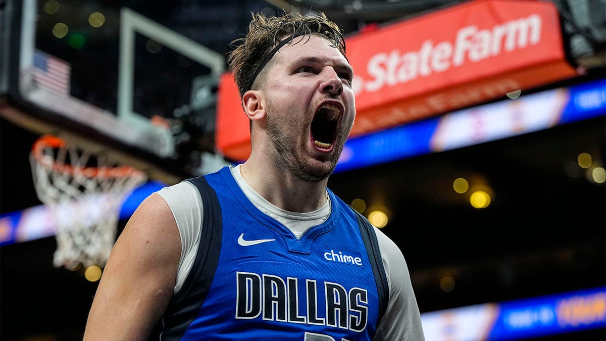Luka Doncic celebrates against the Hawks