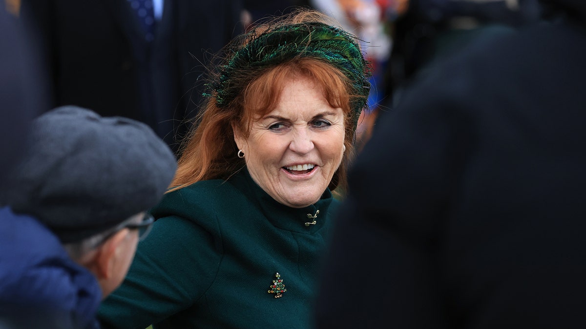 Sarah Ferguson in a green head band and green jacket attending Christmas service