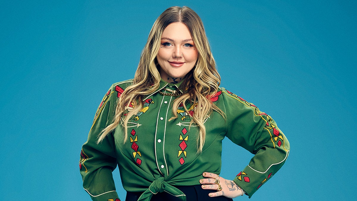 Elle King poses successful  greenish  blouse