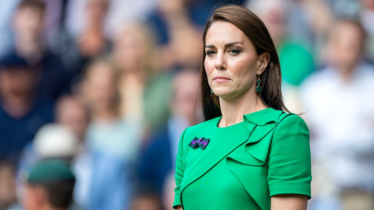 Kate Middleton in a green dress at Wimbledon looks stoic