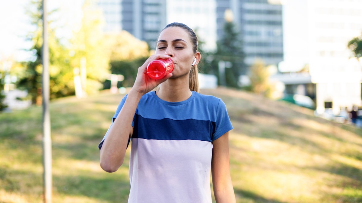 Girl drinking energy drinks