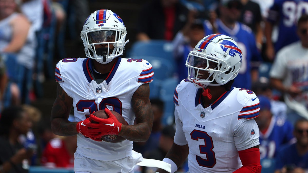 Dane Jackson of the Buffalo Bills, left, celebrates his touchdown with Damar Hamlin during a preseason game against the Indianapolis Colts on Aug. 12, 2023, in Orchard Park, New York.