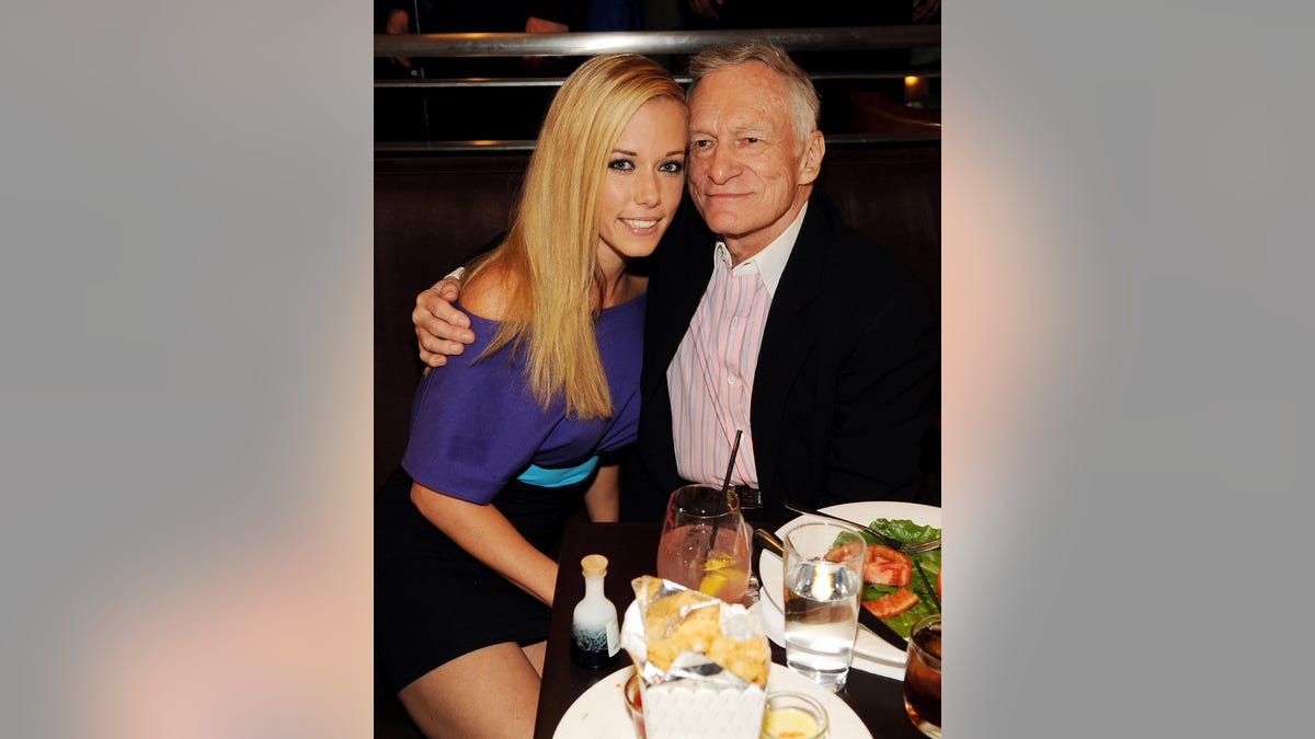 Hugh Hefner embracing Kendra Wilkinson