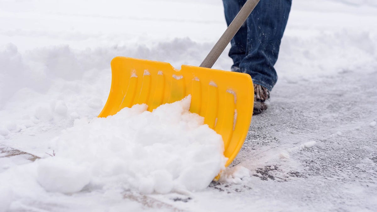 Person shoveling snow