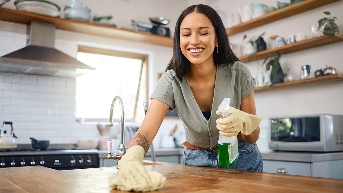 woman cleans the kitchen