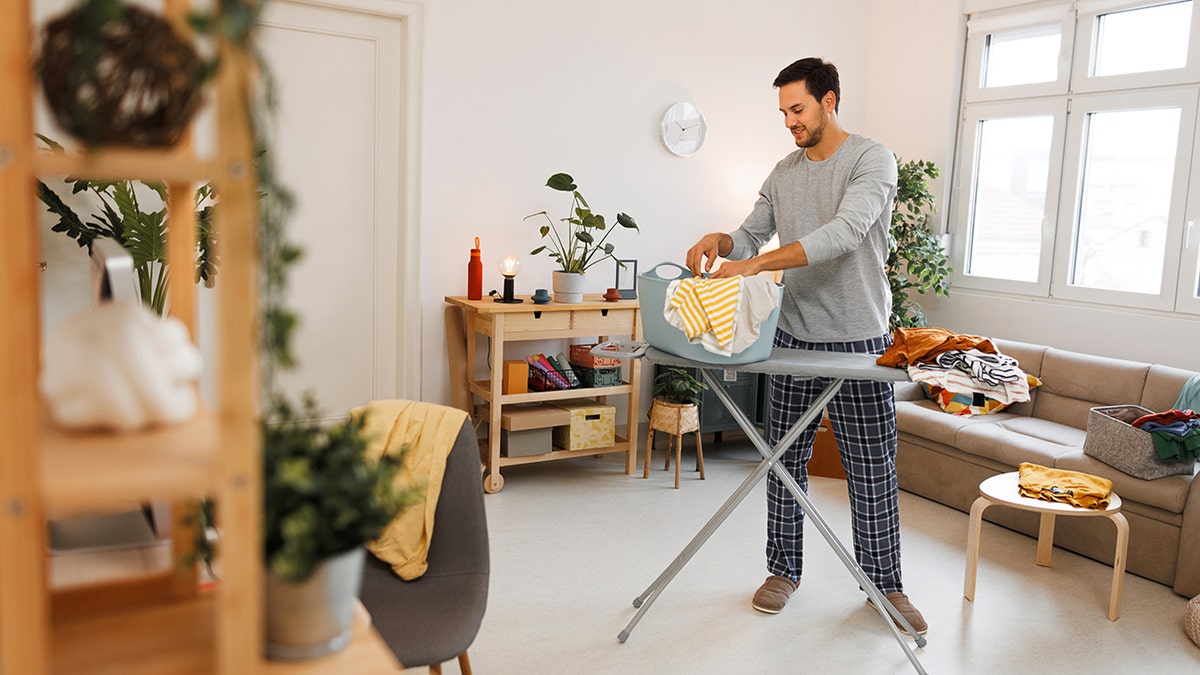 man does chores at home