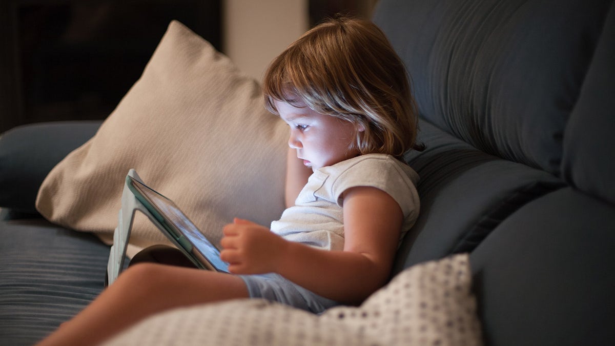 child playing with ipad