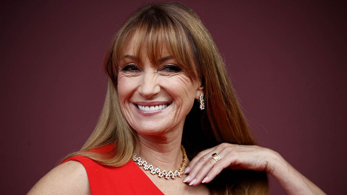 jane seymour in red smiling at camera close up