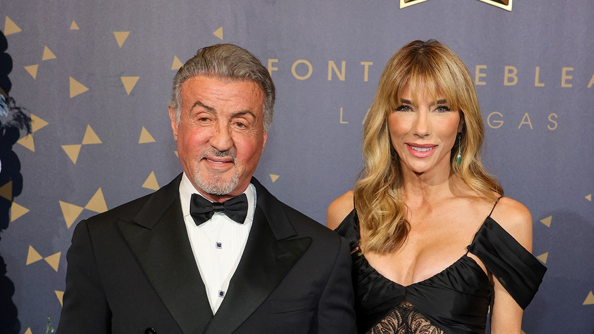 Sylvester Stallone and Jennifer Flavin smiling