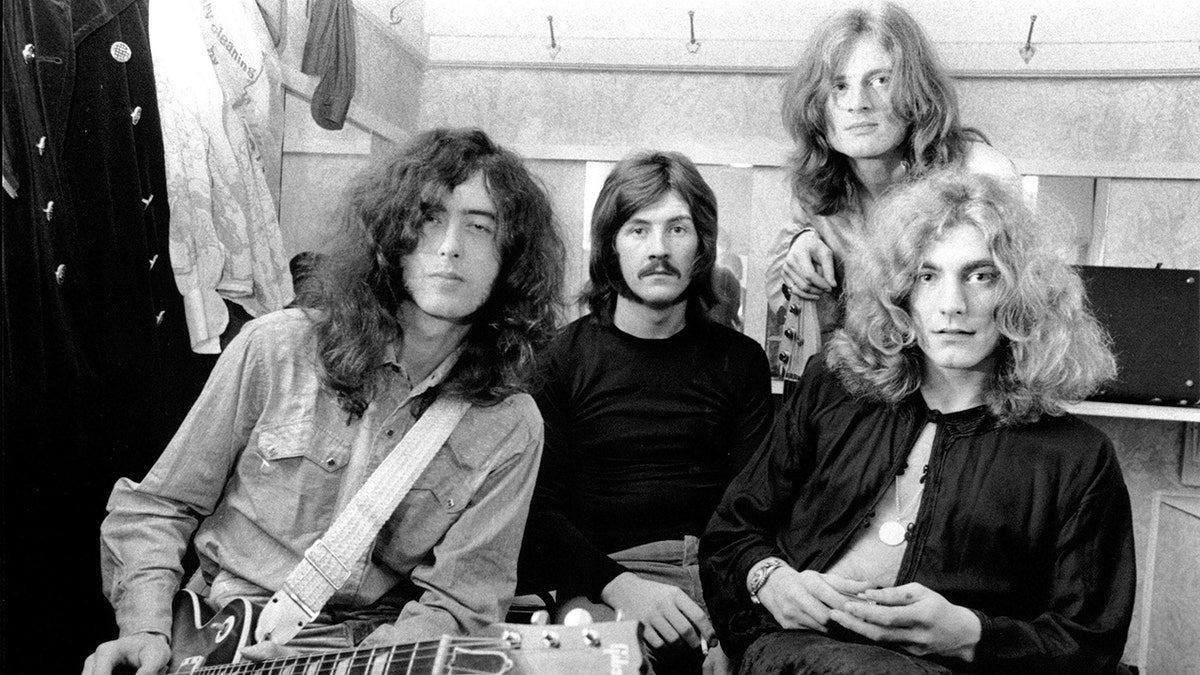 Led Zepplin band members posing for a photo