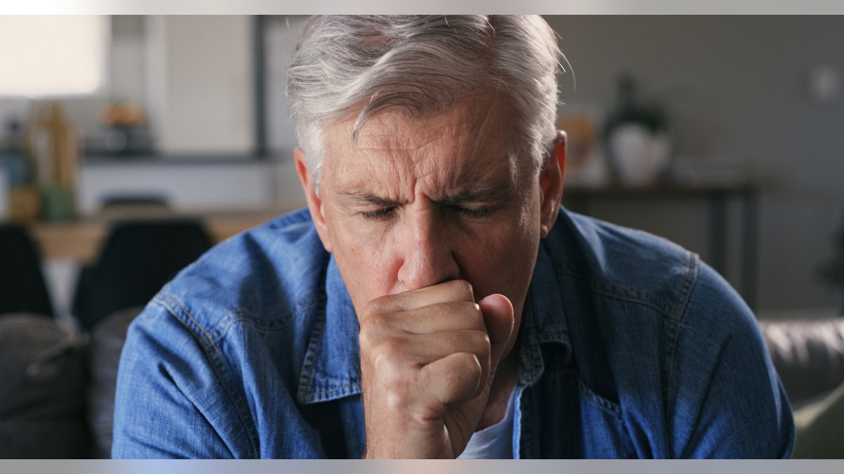 Man coughing