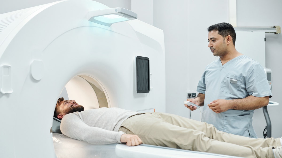 MRI man with technician