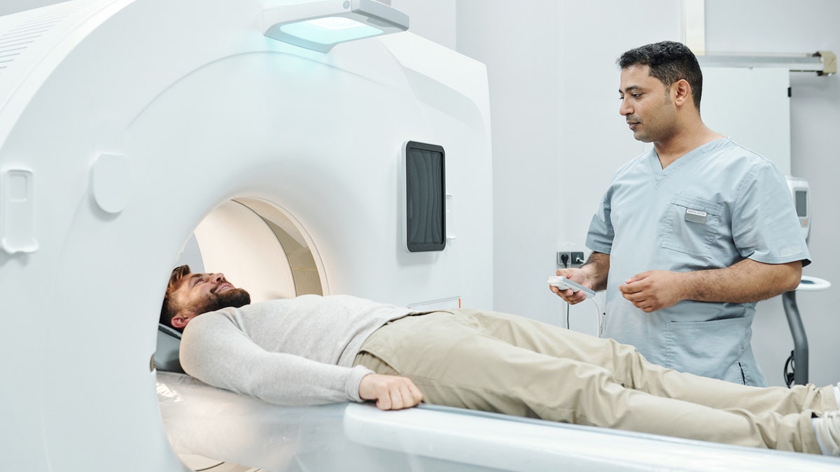 MRI man with technician