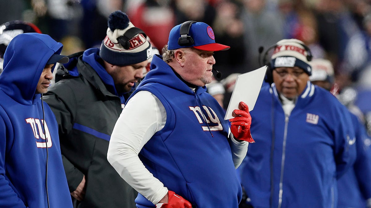 Wink Martindale stands on the sideline