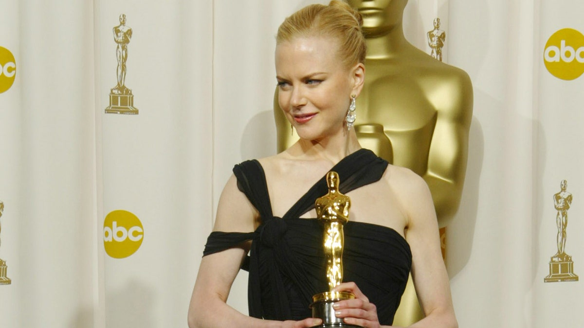 Nicole Kidman posing with her Academy Award