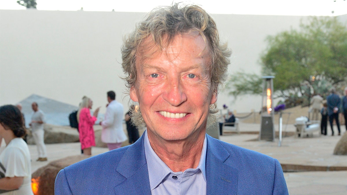 Nigel Lythgoe smiles