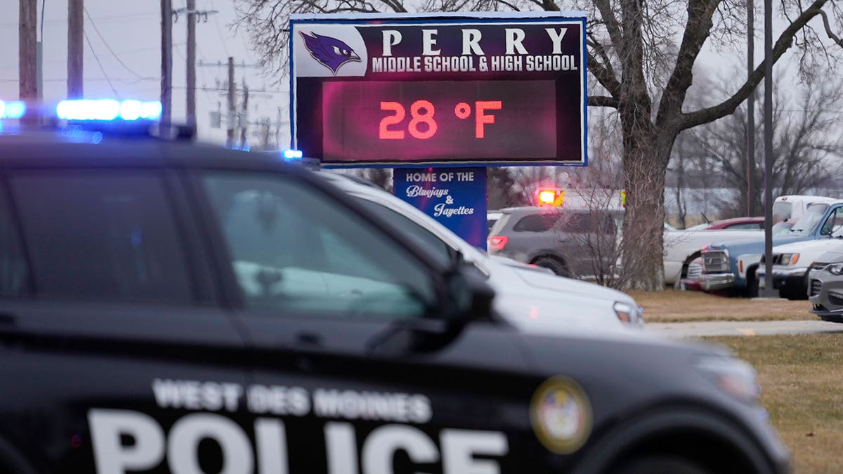 Police vehicle in front of Perry High School