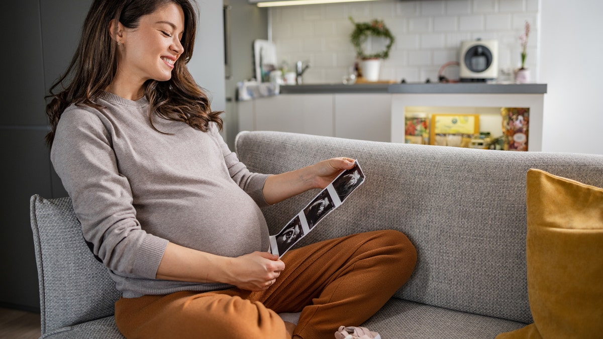 Pregnant woman with ultrasound