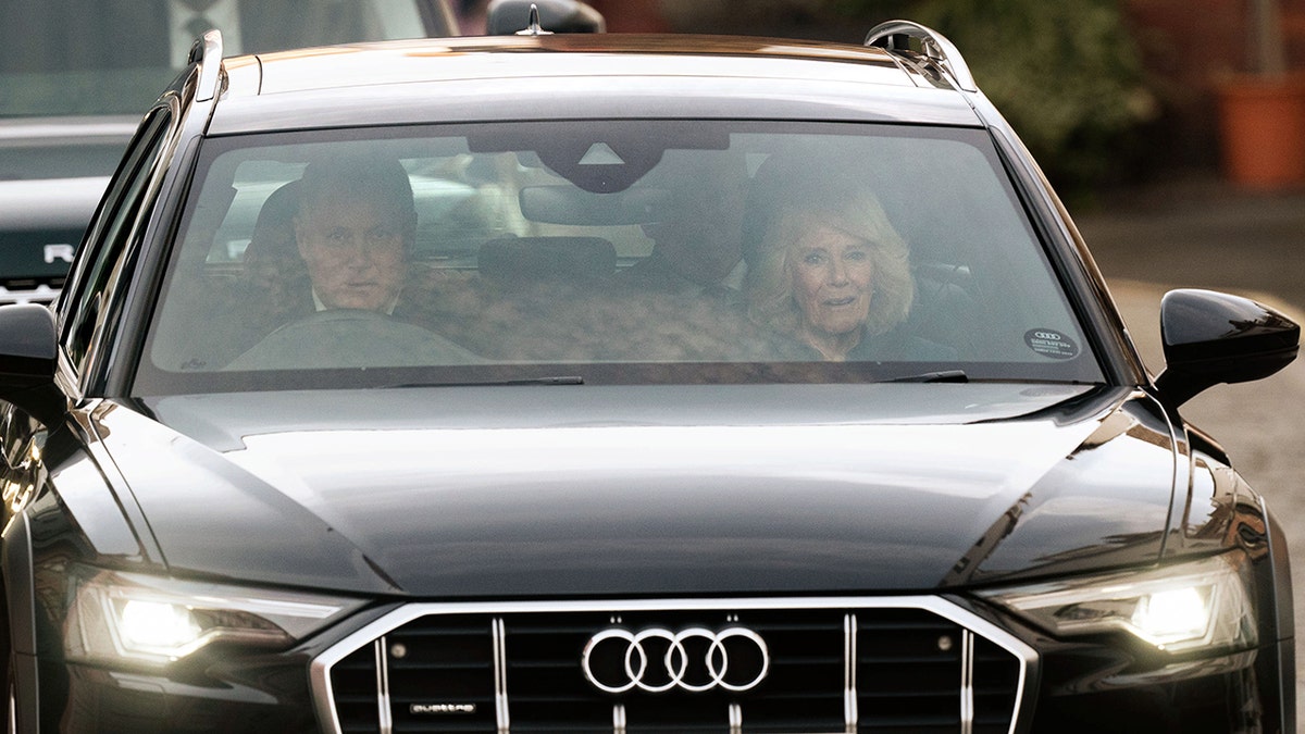 Queen Camilla in a car with gentleman leaving The London Clinic