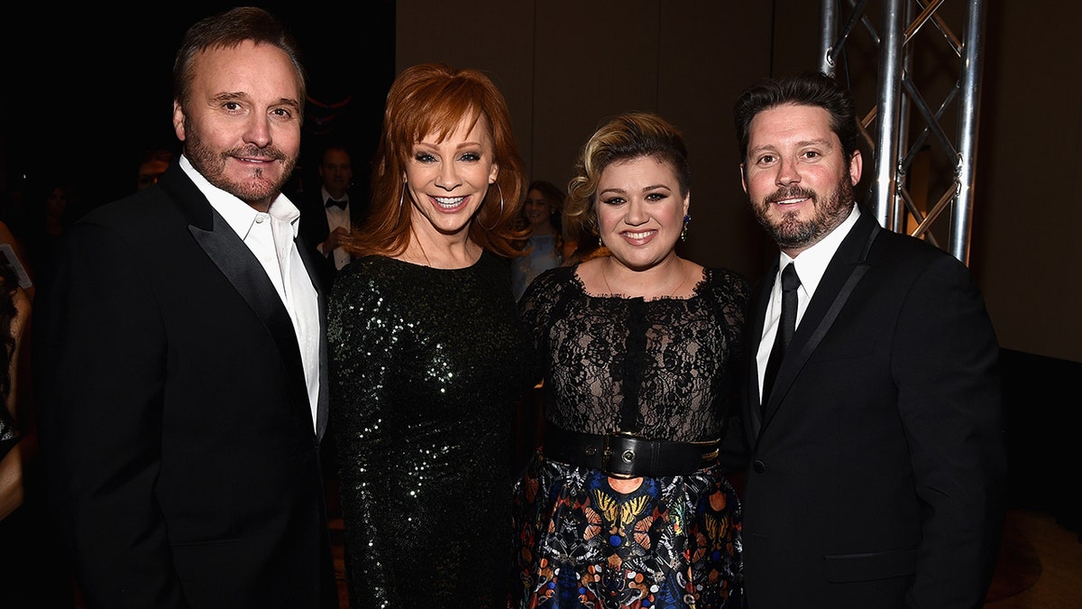 Reba McEntire with her family all dressed in black