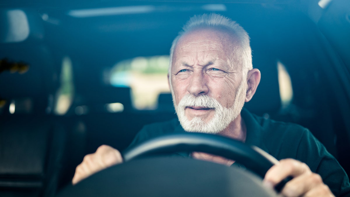 Senior man driving