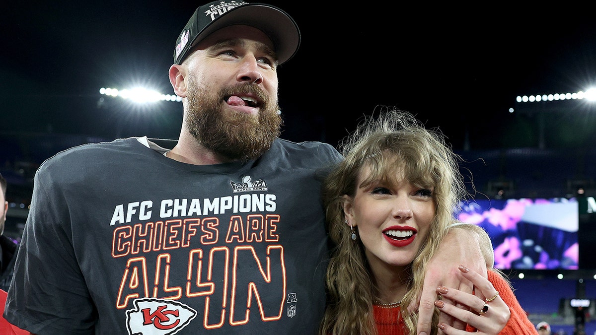 Travis Kelce wraps his arm around Taylor Swift during the NFL playoffs