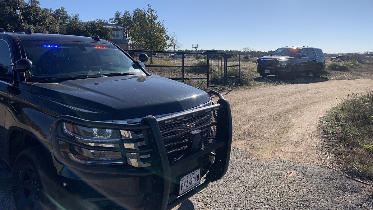 Police SUVs parked near crime scene