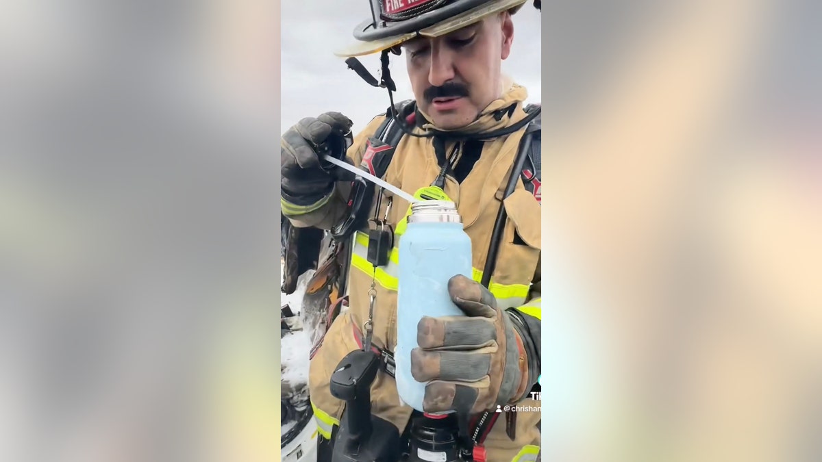 fireman holding Hydro Flask