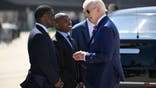 US President Joe Biden (R) is welcomed by Milwaukee Mayor Cavalier Johnson, (C) and Milwaukee County Executive David Crowley (L)  on arrival at Milwaukee International Airport Air National Guard Base in Milwaukee, Wisconsin, August 15, 2023. President Biden is in Milwaukee to tour and speak about Bidenomics at Ingeteam Inc., which specializes electric power conversion. (Photo by ANDREW CABALLERO-REYNOLDS / AFP) (Photo by ANDREW CABALLERO-REYNOLDS/AFP via Getty Images)