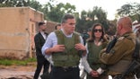 McCormick and his wife speak with IDF officials