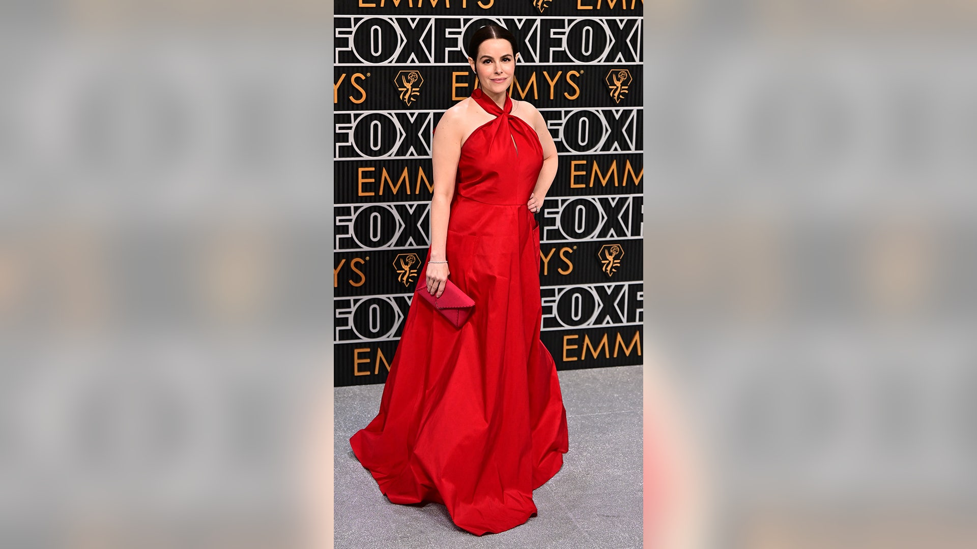 Emily Hampshire arrives for the 75th Emmy Awards