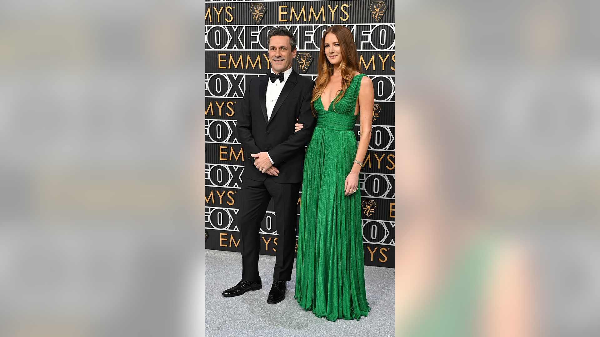 Jon Hamm and Anna Osceola arrive for the 75th Emmy Awards