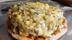 Pizza chefs break Guinness World Record for using 1,001 varieties of cheese on one Italian staple