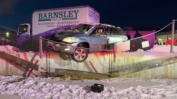 Colorado mother crashes SUV into wall, leaves it hanging 'precariously' with young child in backseat: police