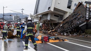Japanese rescue teams race to find earthquake survivors as death count rises