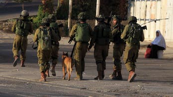 Israeli forces reveal footage of K9 unit clearing houses in Gaza, uncovering Hamas weapons