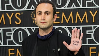 'The Crown' actor poses with message on palm in call for Gaza ceasefire on Emmys red carpet