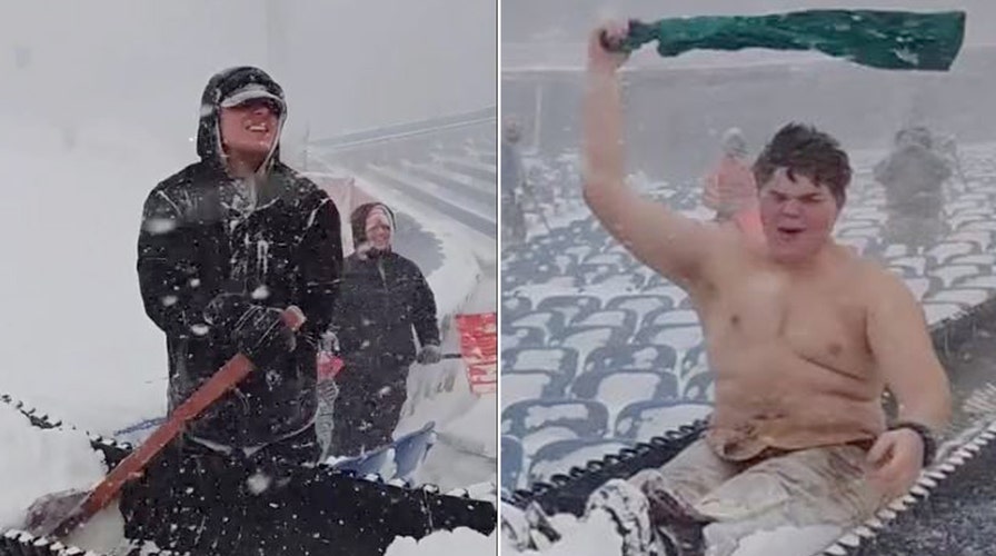 Shirtless Bills fan slides down chute as he shovels snow at Highmark Stadium 