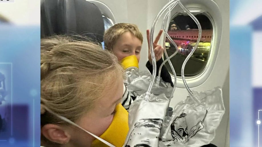 Children in oxygen masks on a plane