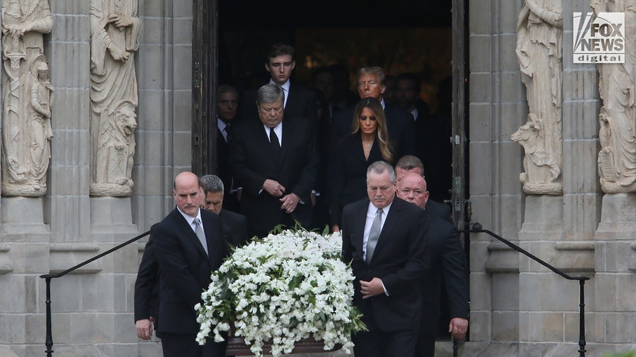 The casket of Amalija Knavs is carried as former First Lady Melania Trump, husband Viktor Knavs, former President Donald Trump and Barron Trump depart following Knavs’ funeral