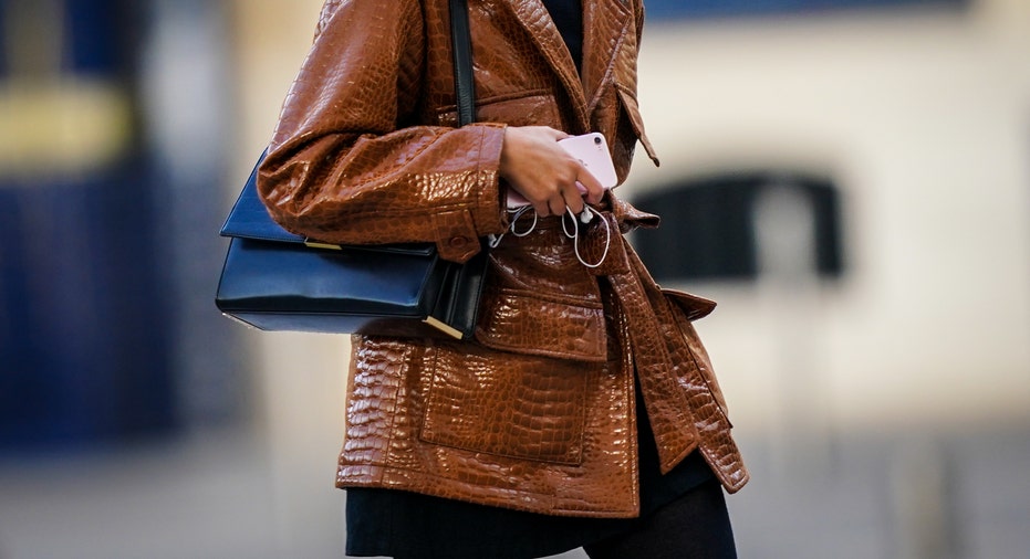 Woman with brown leather jacket