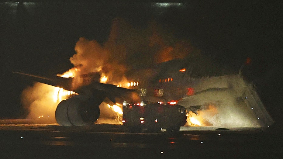 Japan Airlines plane bursts into flames after collision at Tokyo's Haneda airport, leaving 5 dead