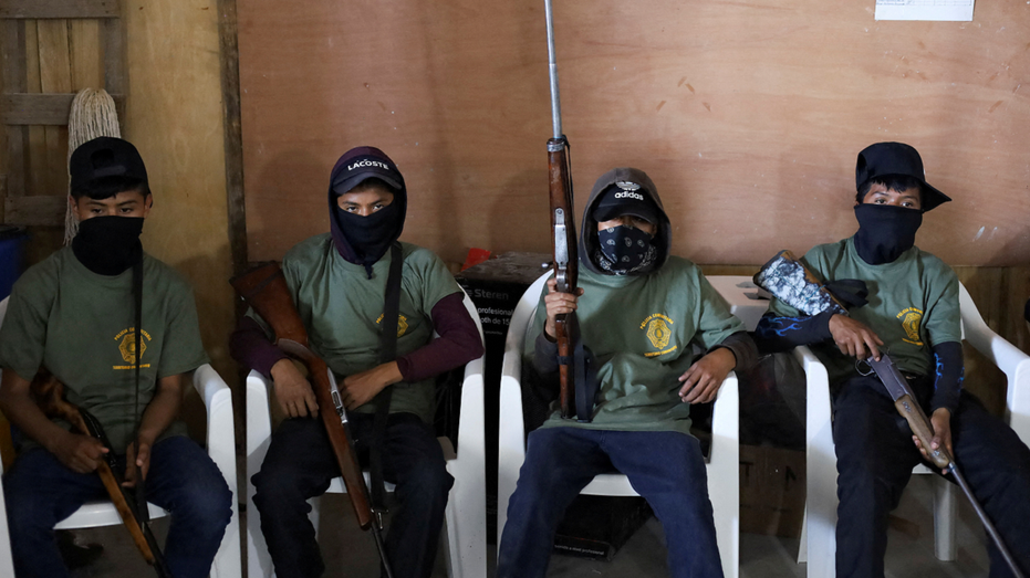 Photos show Mexican children wielding rifles as volunteer police force battles organized crime