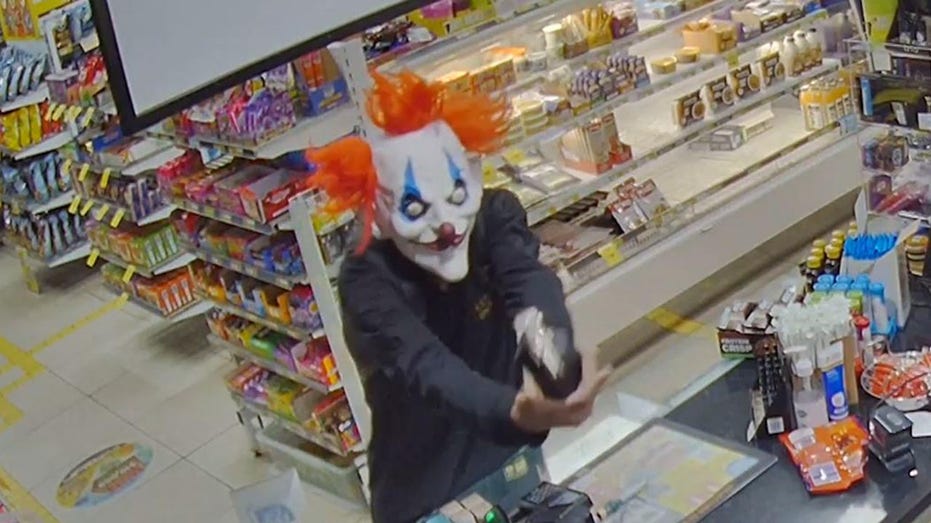 WATCH: Clown mask wearing suspect robs convenience store at gunpoint, runs off with loot