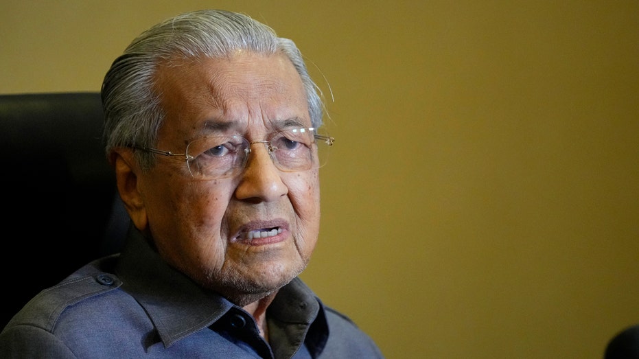 Former Malaysian leader dismisses graft probe into his son as political hit