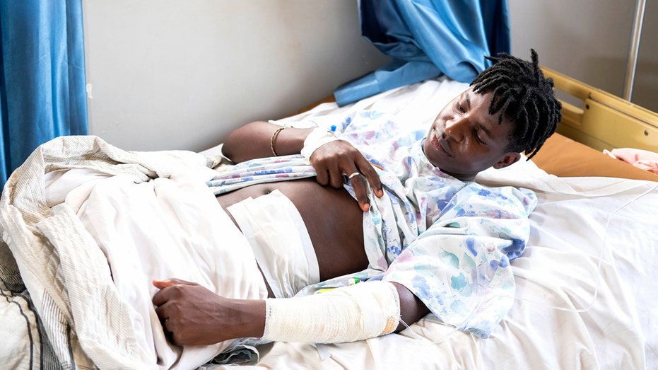 Stabbed Ugandan gay rights activist blames political rhetoric for attack