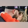 Travis Kelce shares a kiss with Taylor Swift