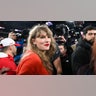 Taylor Swift walks off the field after the Kansas City Chiefs won the AFC Championship football game