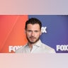 Adan Canto smiling