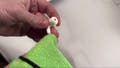 Using a lint-free cloth to clean AirPods